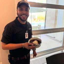 a man holding a dessert