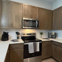 a kitchen with wood cabinets
