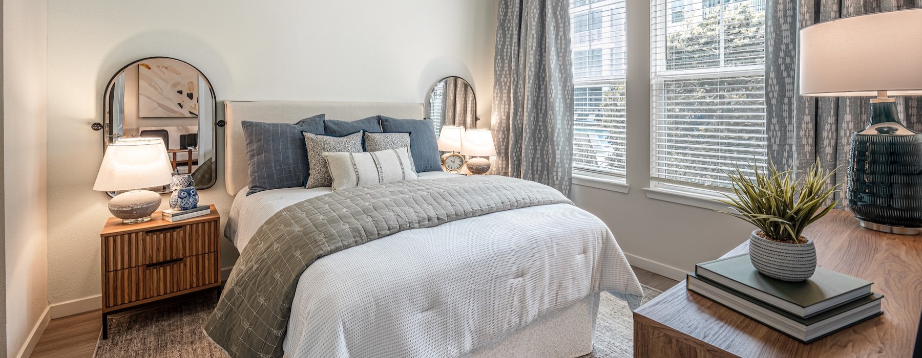 a bedroom with a bed and a table