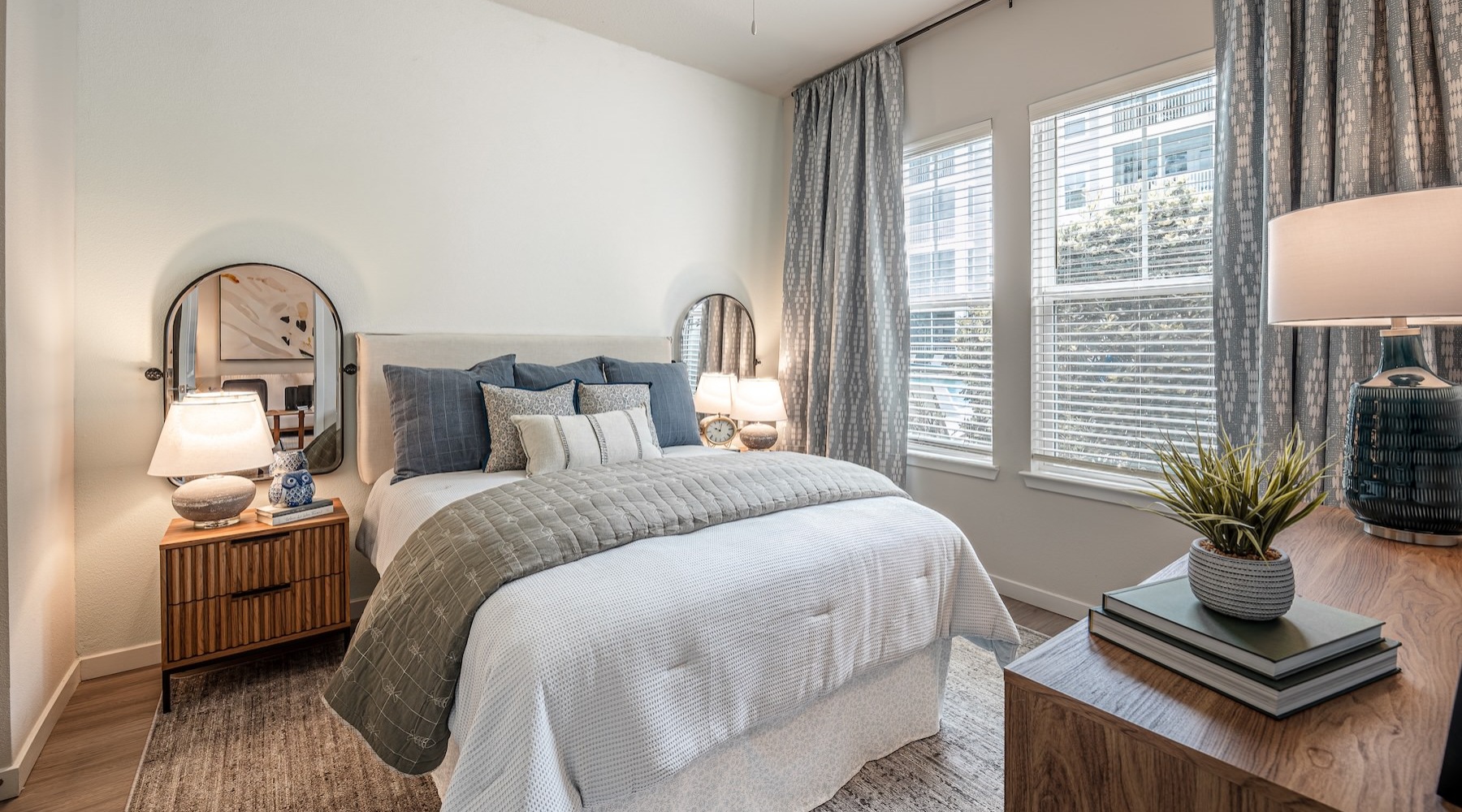 a bedroom with a bed and two nightstands